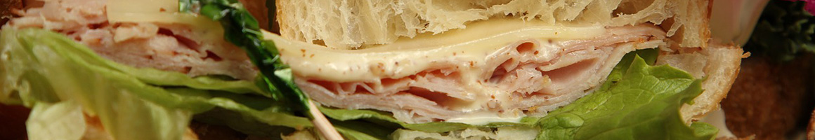 Eating Deli Sandwich at Kathy's Deli restaurant in Chico, CA.